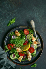 Vegetable salad with grilled chicken. Top view with copy space.