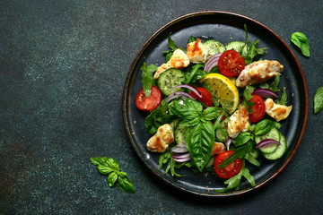 Vegetable salad with grilled chicken. Top view with copy space.