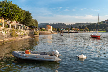 Fototapeta na wymiar Promenade on the shore of Lake Maggiore in Laveno Mombello, province of Varese, Italy