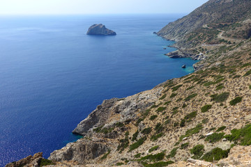 Photo of picturesque Monastery of Panagia Hozoviotissa built on a steep cliff with view to Aegean deep blue, Amorgos island, Cyclades, Greece