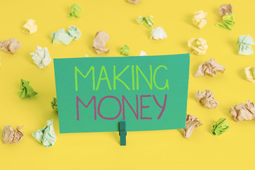 Writing note showing Making Money. Business concept for Giving the opportunity to make a profit Earn financial support Colored crumpled paper empty reminder white floor clothespin