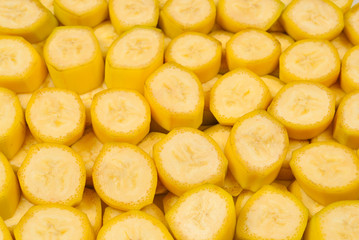 Fresh banana slices background. Top view.