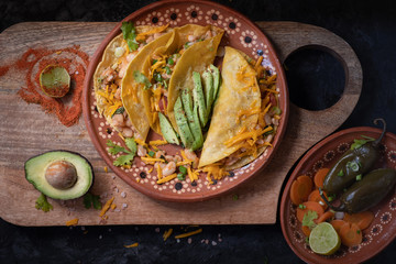 Vegetarian soft tacos served on a traditional Mexican clay  plate