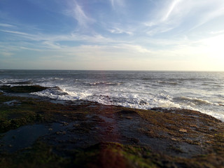 Waves reaching the rocky coast of Bali, Indonesia