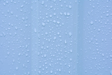 Naklejka na ściany i meble Water drops after rain on a corrugated profile roofing sheet. Abstract background image texture.