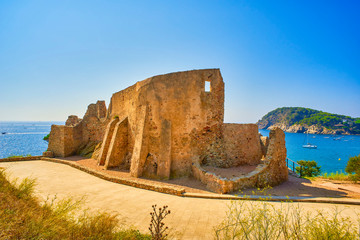 Castle of Sant Esteve at sunny day. La Fosca Cove. Palamos, Girona province, Catalonia, Spain.