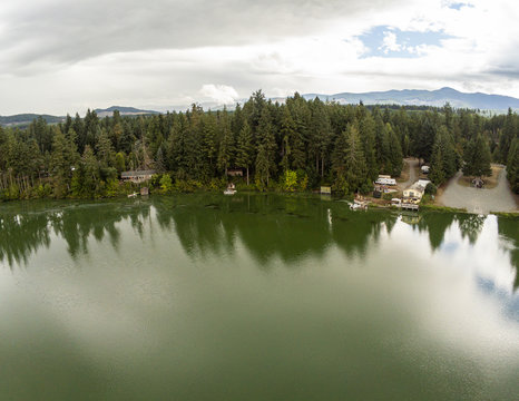 Outstanding aerial photos of Thurston County's photogenic Clear Lake and the mirrored reflection of the surrounding trees in the  clear water.