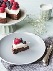 Cake made from chocolate and chestnut puree with fresh fruits on the top.