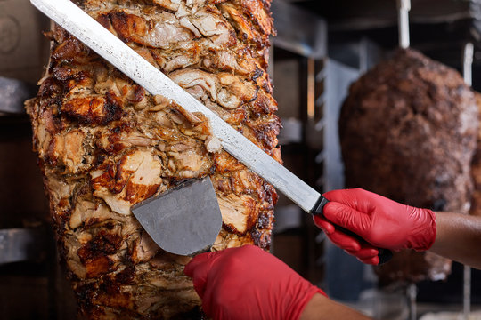 Fried meat on a skewer for cooking of donors or shawarma. Close-up