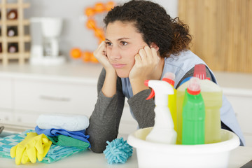 woman boring with cleaning products