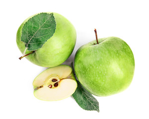 Fresh ripe green apples with leaves on white background, top view