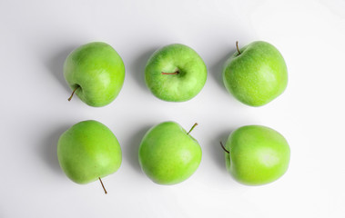 Fresh ripe green apples on white background, top view