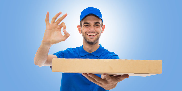 pizza delivery man smiling with okay sign on blue background