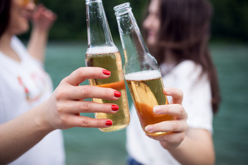 Two girls enjoying a cold beer