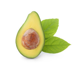 Half of ripe avocado and leaves on white background