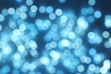Blurred view of Christmas lights on dark background