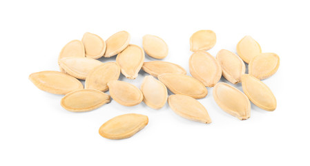 Pile of raw pumpkin seeds on white background