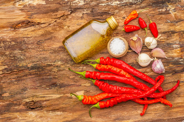 Red and orange chili pepper with garlic cooking food background