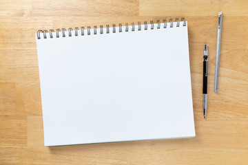 Blank Sketch Paper Tablet Binder Resting on Desk Top with Engineering Pencil and Ruler