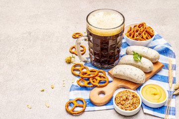 Oktoberfest set. Dark beer, weisswurst, pretzels, mustard, spikelets of grain, hop