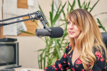 Woman interviewed in a broadcasting studio
