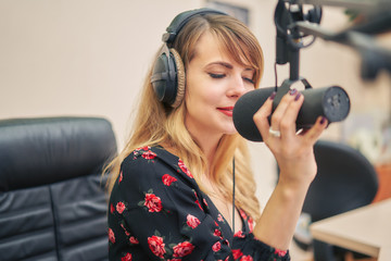 Radio DJ announces news in the studio