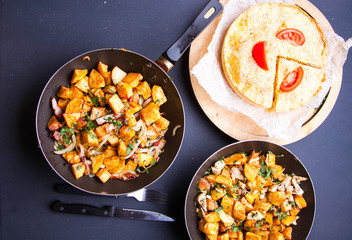 Fried meat in a frying pan closeup. Top view with copy space