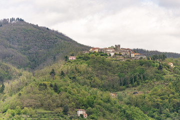 Fototapeta na wymiar Tuscany. A village in a valley near the town of Barga. An old hill town in Italy.
