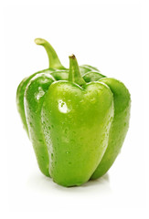 Ripe sweet pepper of a green color on a white background.