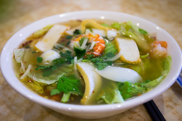 Vietnamese seafood noodle soup in the bowl