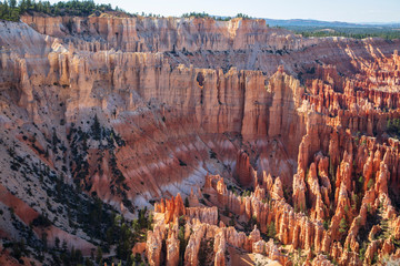 The spectacle of thousands of glowing orange earthen spires concentrated in the valley below the...
