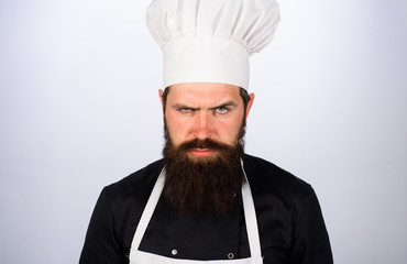 Cooking and food concept. Professional chef, cook or baker. Male chef. Bearded chef in uniform, hat and apron. Chief cook and professional culinary. Chief cook and professional culinary. Food concept.
