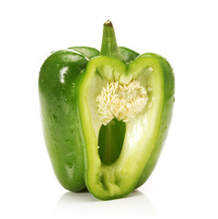 Ripe sweet pepper of a green color on a white background.