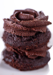Chocolate cupcakes with various flavours of whipped cream