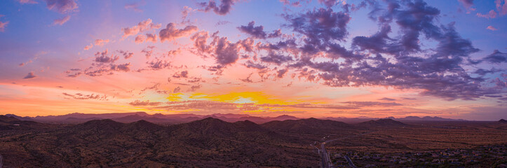 Sunrise panorama over the sonoran desert of Arizona with layers of mountains shot at altitude by a...