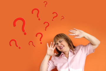 question marks around a woman who threw up her hands in despair, psychological concept