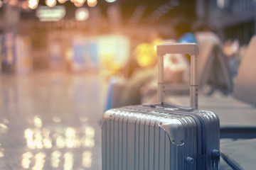 luggage holder on suitcase or bag with TRAVEL INSURANCE ,traveling luggages in an airport...