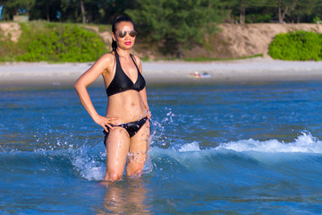 Woman show body sexy with black bikini