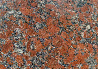 The wall is made of red-flecked marble.