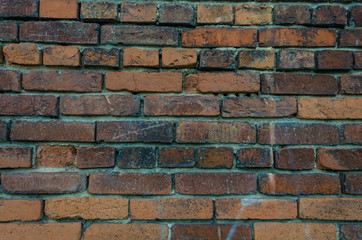 Old brick wall.Masonry of colored bricks.