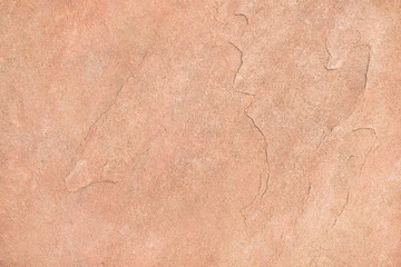 Close up of ancient red brown stone wall texture background with copy space.