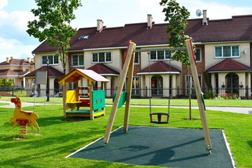 Fototapeta na wymiar Wooden swing on children playground.
