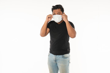 Fototapeta premium Asian man wearing face masks due to the haze situation isolated on white