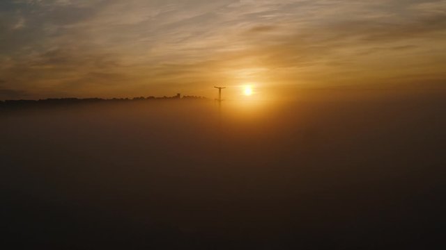 Aerial view from fog to sunrise