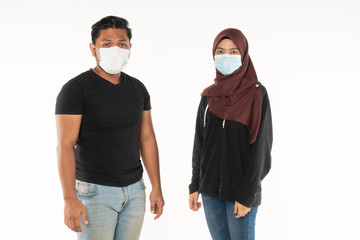 Asian people wearing a masks due to the haze in situation and look at the camera