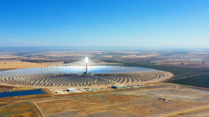 Large solar thermal plant uses mirrors that focus the sun's rays on a collection tower to produce...