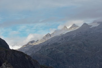 Naklejka premium A stream rolling down a till bed. Alaska