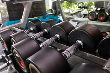 Fototapeta na wymiar heavy metal exercise dumbbells in fitness room .