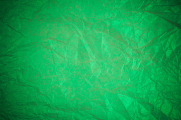 Fototapeta na wymiar Crumpled green paper recycling background.