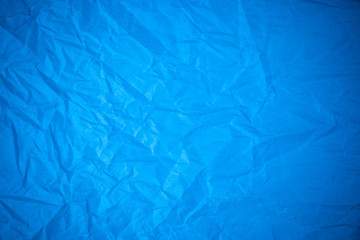 Blue paper crumpled recycle background.